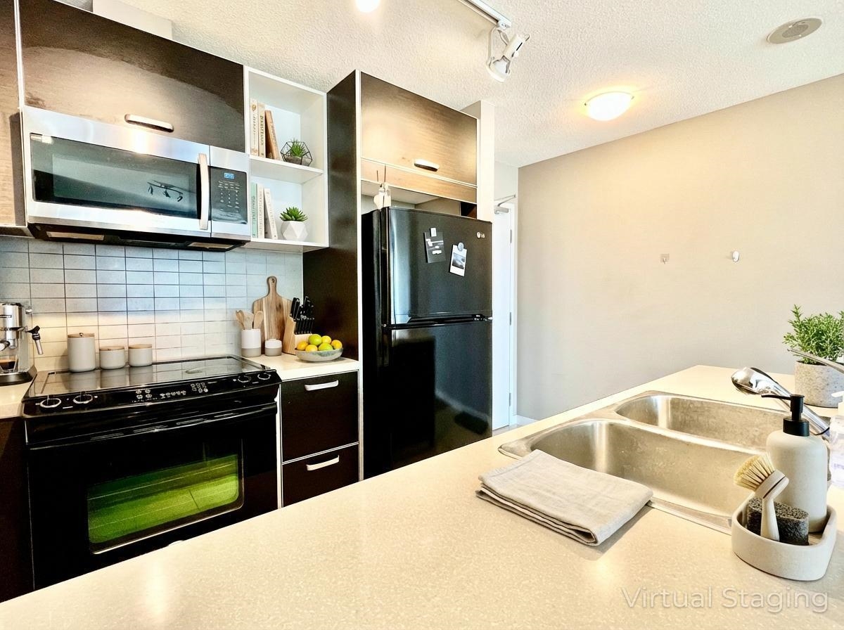 Family Room Photo of 609 13688 100 Avenue, Surrey, BC