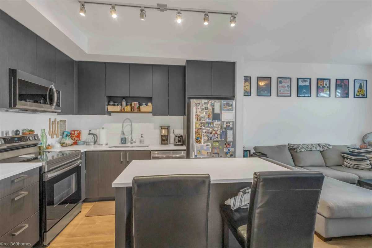 Living Room Photo of 313 13623 81a Avenue, Surrey, BC