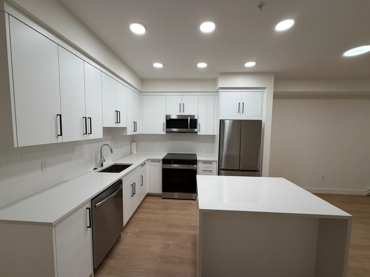 Living Room Photo of 309 33816 South Fraser Way, Abbotsford, BC