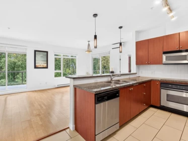 Kitchen Island Photo of 304 100 Capilano Road, Port Moody, BC