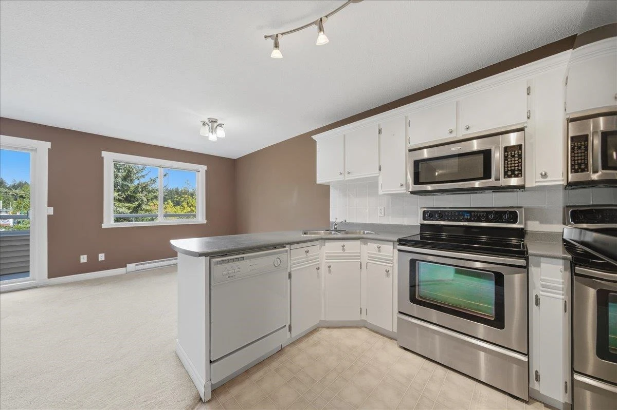 Living Room Photo of 411 450 Bromley Street, Coquitlam, BC