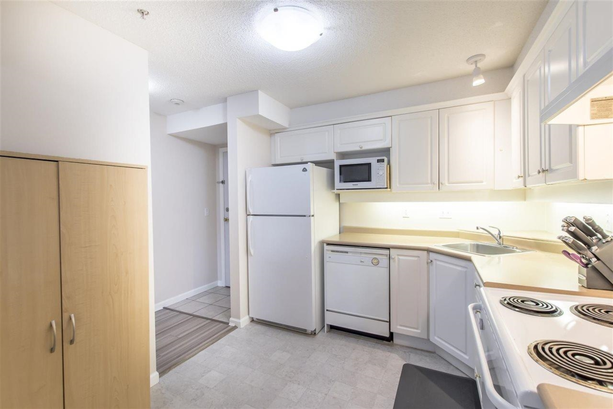 Living Room Photo of 308 13780 76 Avenue, Surrey, BC