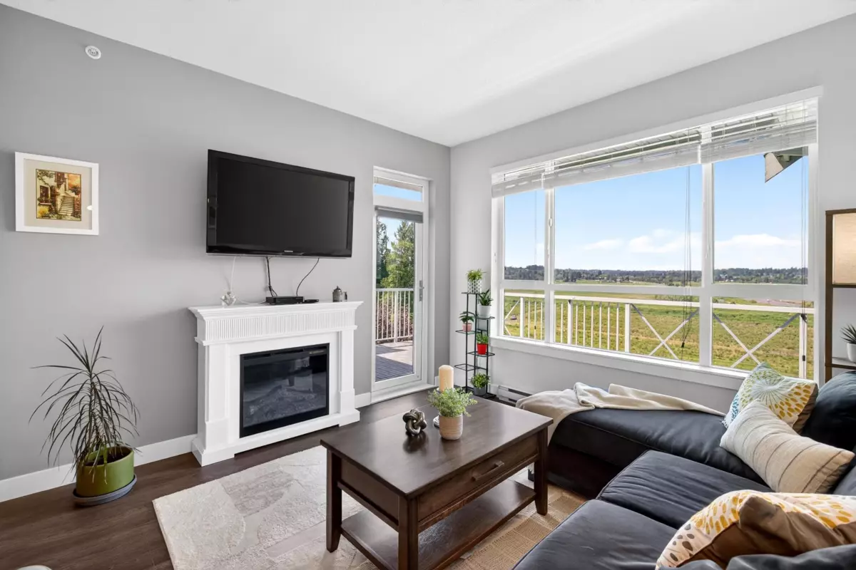 Family Room Photo of 406 16380 64 Avenue, Surrey, BC