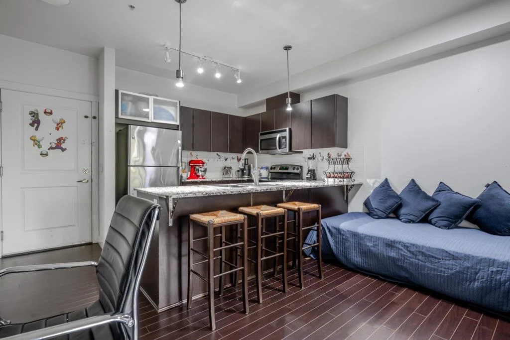Living Room Photo of 309 9655 King George Boulevard, Surrey, BC