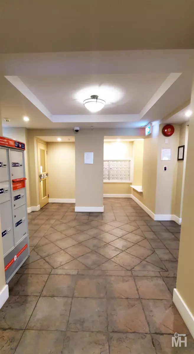 Living Room Photo of 111 15392 16a Avenue, Surrey, BC