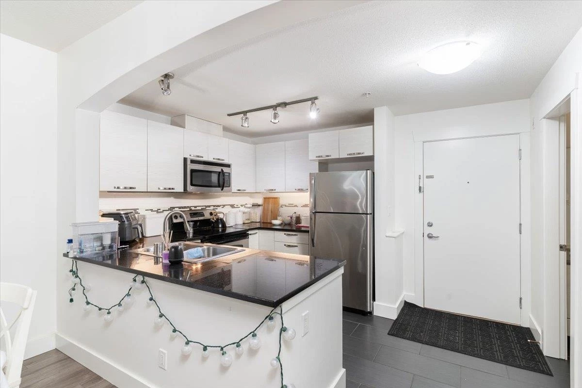 Kitchen Island Photo of 112 7478 Byrnepark Walk, Burnaby, BC