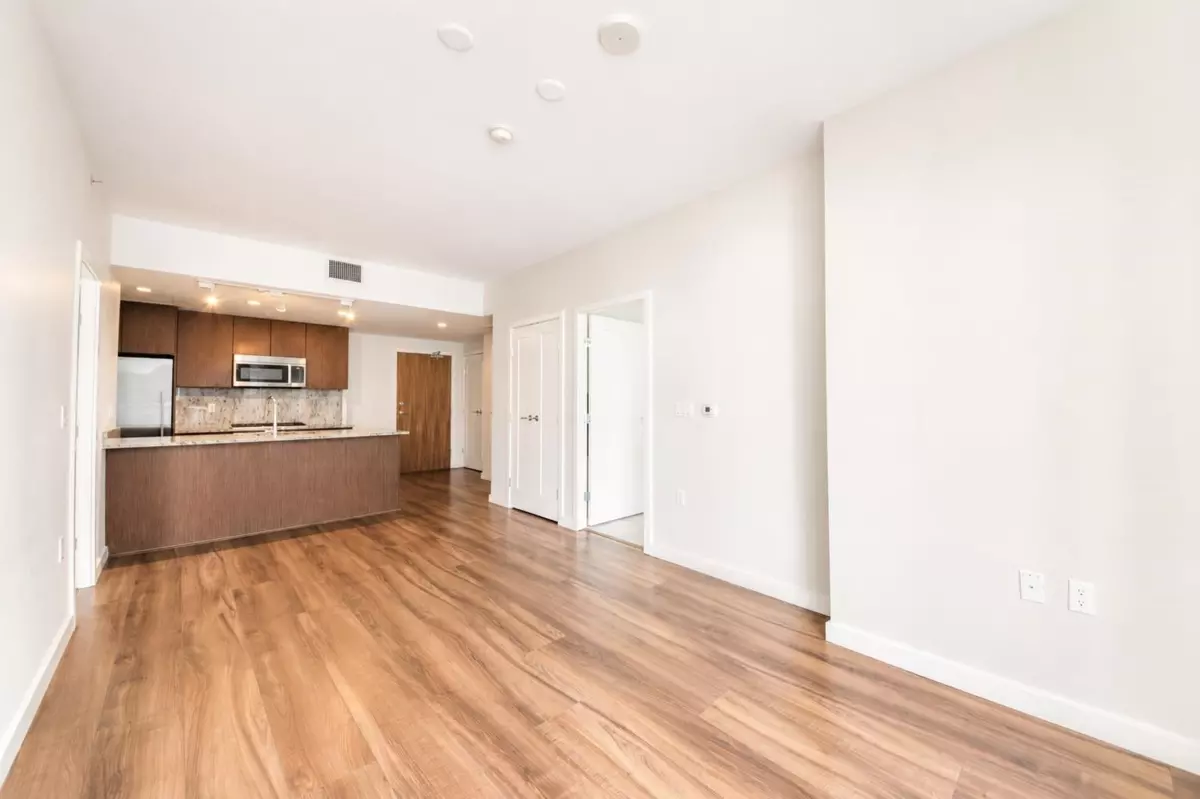 Living Room Photo of 812 8688 Hazelbridge Way, Richmond, BC