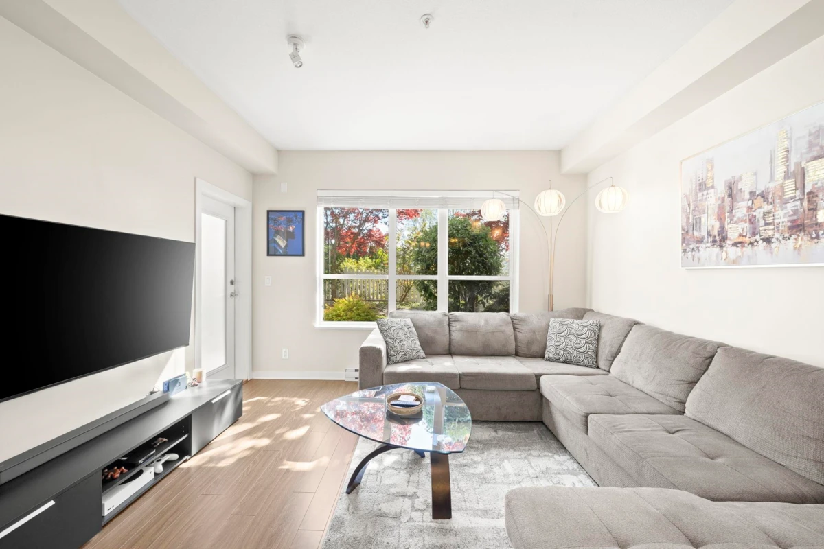 Living Room Photo of 106 6460 194 Street, Surrey, BC