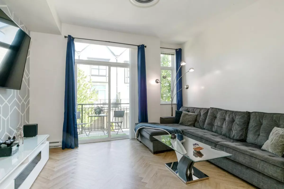 Living Room Photo of 106 17578 57a Avenue, Surrey, BC
