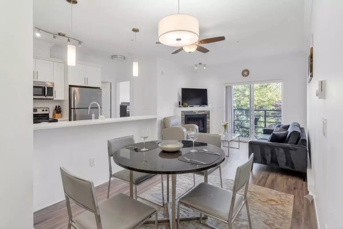 Living Room Photo of 320 8183 121a Street, Surrey, BC