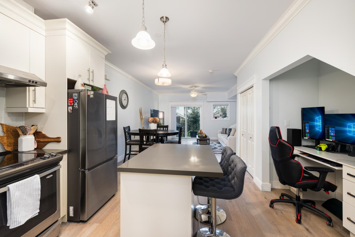 Family Room Photo of 105 3488 Sefton Street, Port Coquitlam, BC