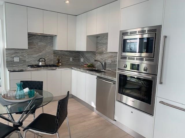 Family Room Photo of 203 185 Victory Ship Way, North Vancouver, BC