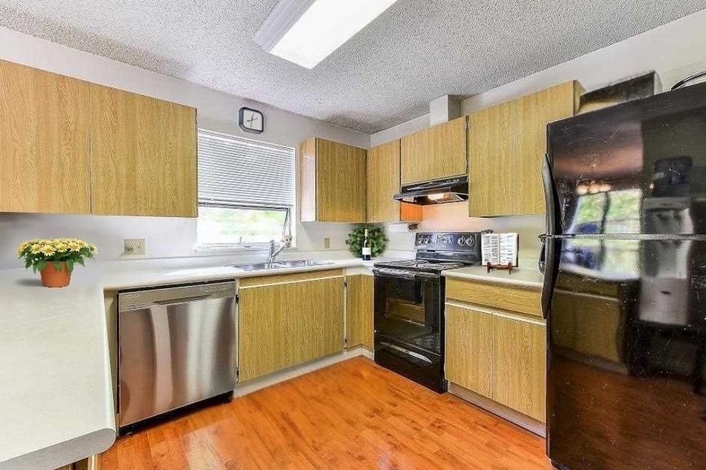 Living Room Photo of 202 7131 133a Street, Surrey, BC