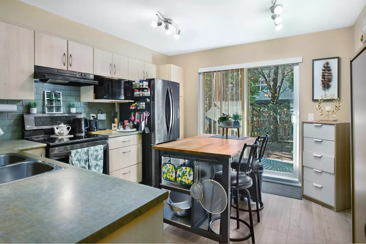 Living Room Photo of 107 6747 203 Street, Langley, BC