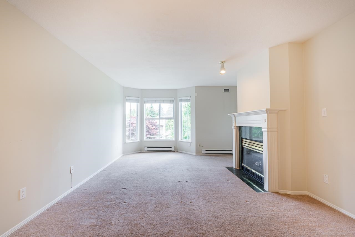 Living Room Photo of 314 15110 108 Avenue, Surrey, BC