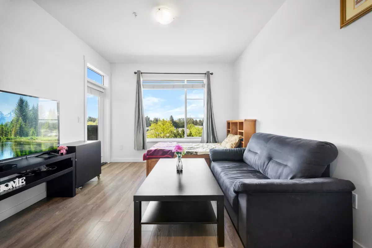 Living Room Photo of 608 13623 81a Avenue, Surrey, BC