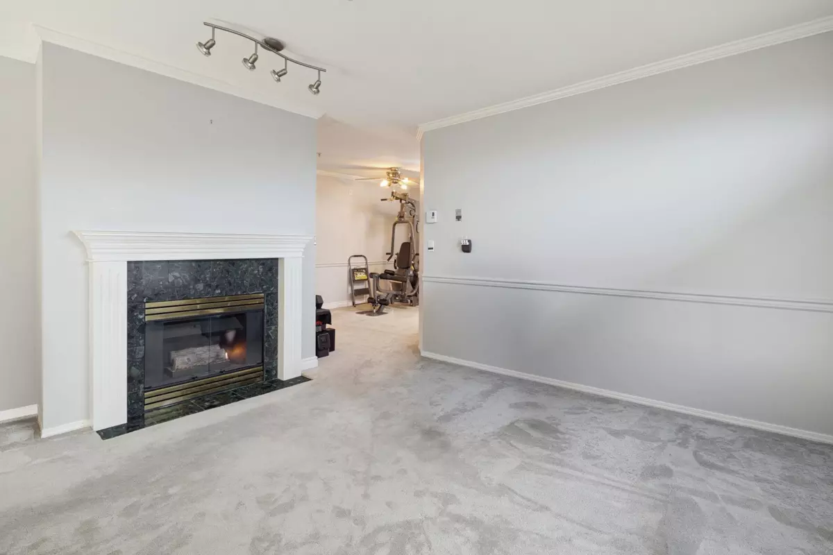 Living Room Photo of 305 5977 177b Street, Surrey, BC