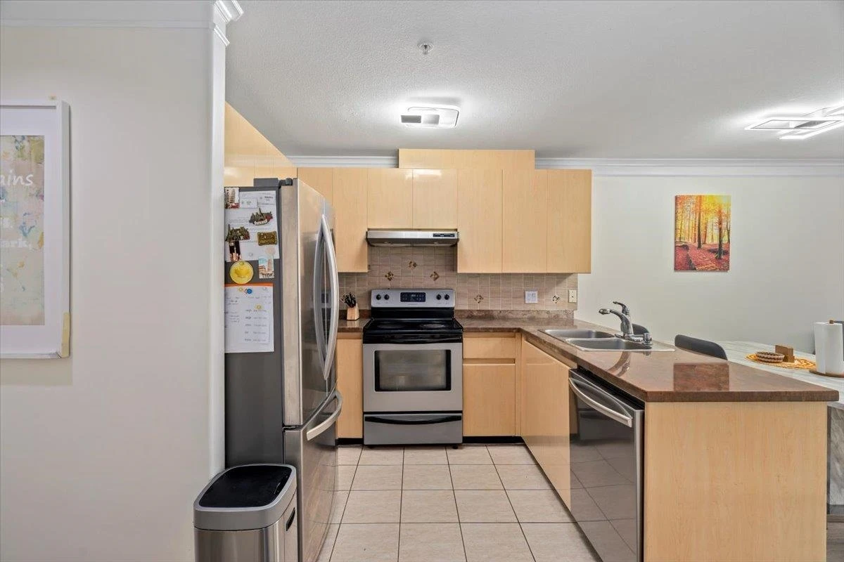 Living Room Photo of 309 8115 121a Street, Surrey, BC