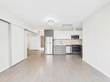 Living Room Photo of 202 13303 103a Avenue, Surrey, BC