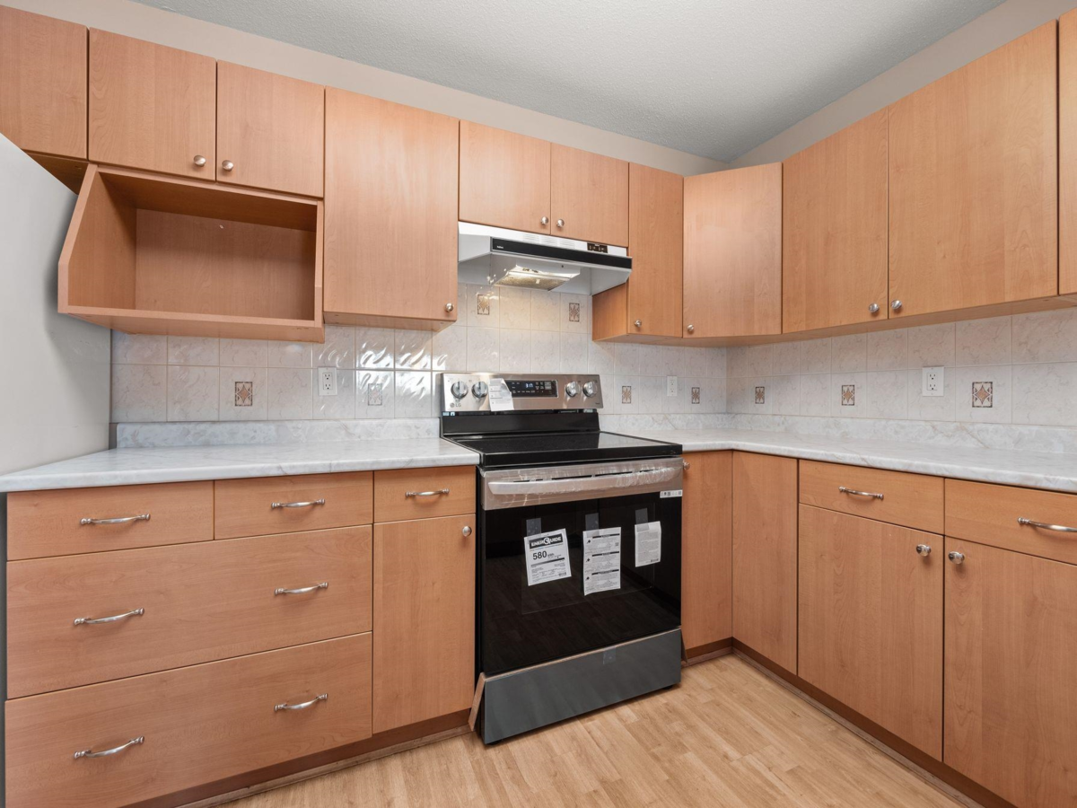 Living Room Photo of 204 1140 55 Street, Delta, BC