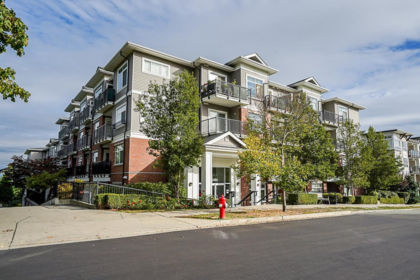 Front exterior of 316 6480 195a Street, Surrey, BC