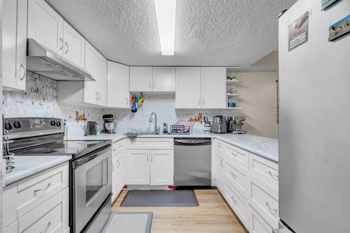 Bedroom 2 Photo of 102 7150 133 Street, Surrey, BC