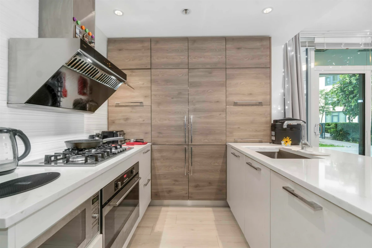 Living Room Photo of 402 7388 Kingsway, Burnaby, BC