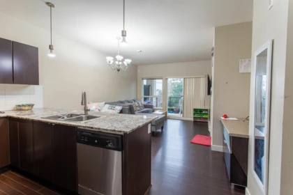 Living Room Photo of 409 9655 King George Boulevard, Surrey, BC