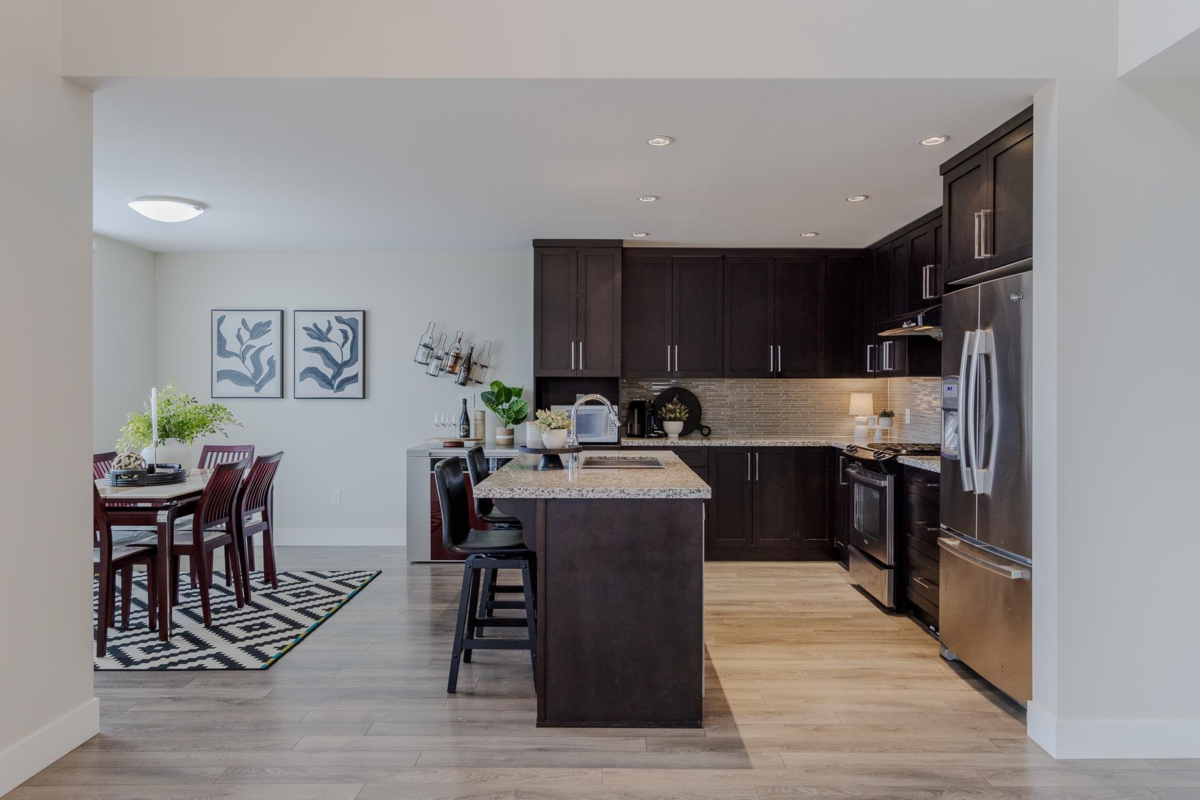 Family Room Photo of 102 3458 Burke Village Promenade, Coquitlam, BC