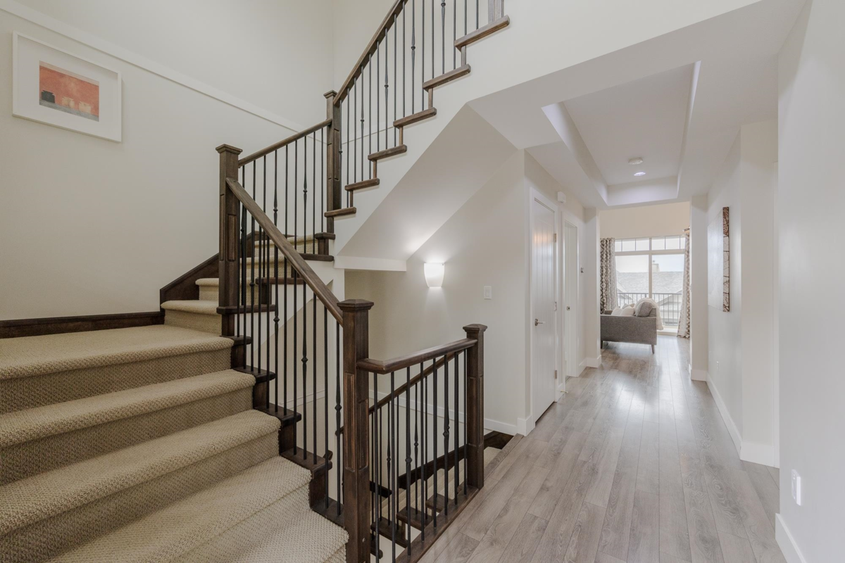 Living Room Photo of 102 3458 Burke Village Promenade, Coquitlam, BC