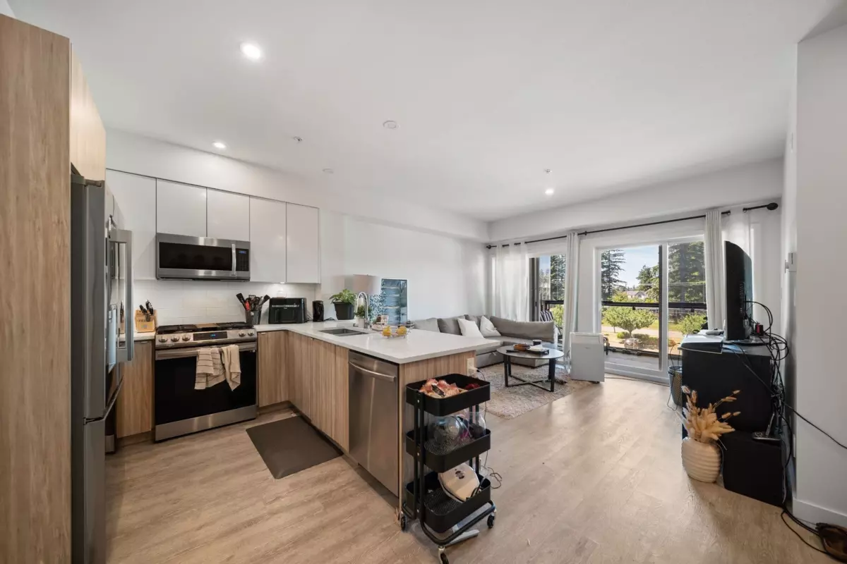 Living Room Photo of 410 2649 James Street, Abbotsford, BC