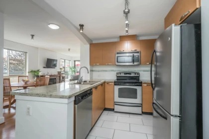 Kitchen Island Photo of 302 7428 Byrnepark Walk, Burnaby, BC