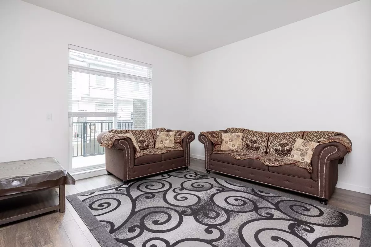 Family Room Photo of 4 13629 81a Avenue, Surrey, BC