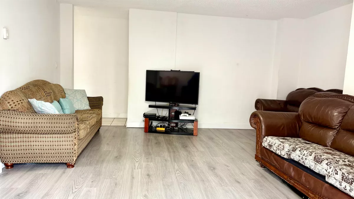 Living Room Photo of 101 7131 133a Street, Surrey, BC