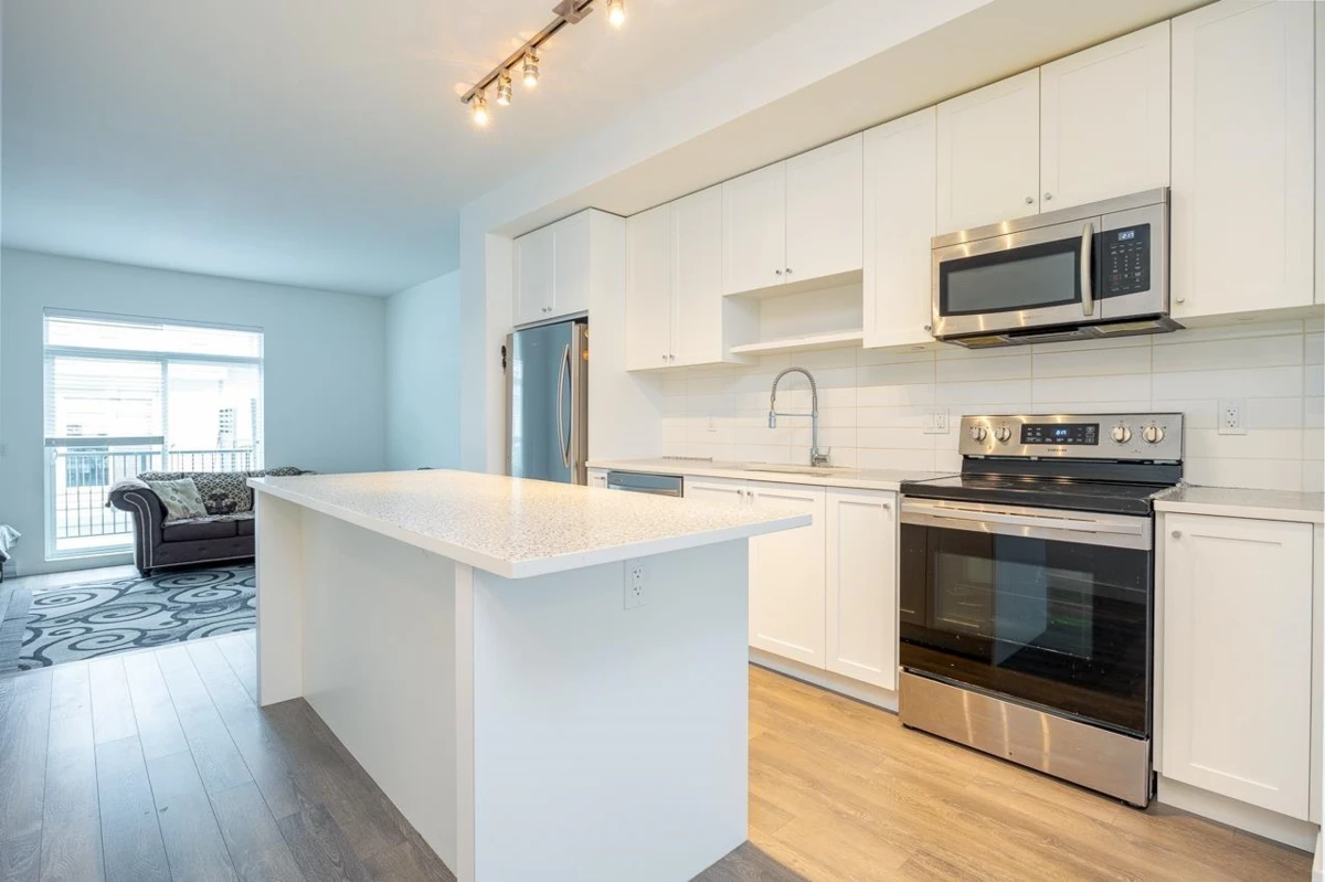 Family Room Photo of 4 13629 81a Avenue, Surrey, BC