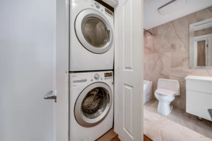 Laundry Room Photo of 305 185 Victory Ship Way, North Vancouver, BC