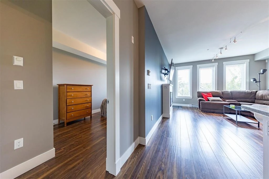 Living Room Photo of 210 5665 177b Street, Surrey, BC