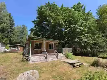 Front exterior of 660 Andy's Bay Road, Gambier Island, BC