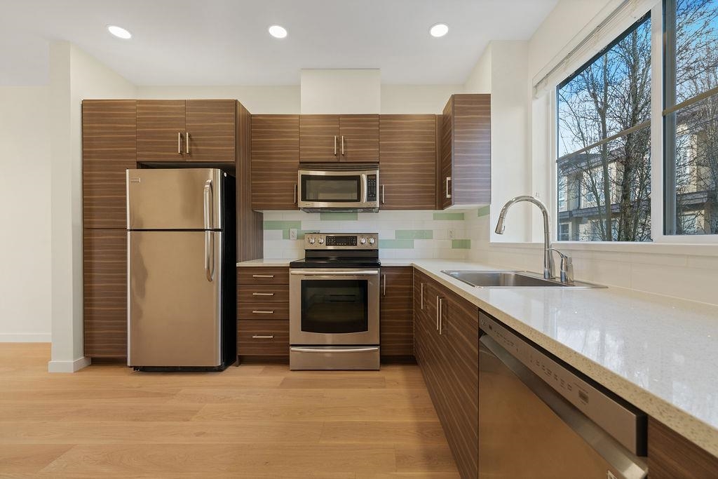 Family Room Photo of 39 19477 72a Avenue, Surrey, BC