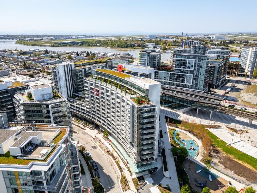 Living Room Photo of 581 8671 Hazelbridge Way, Richmond, BC