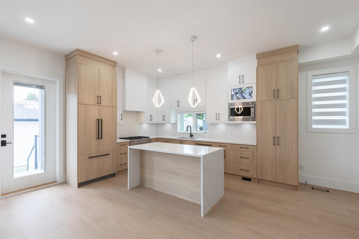 Family Room Photo of 2 6964 Inverness Street, Vancouver, BC