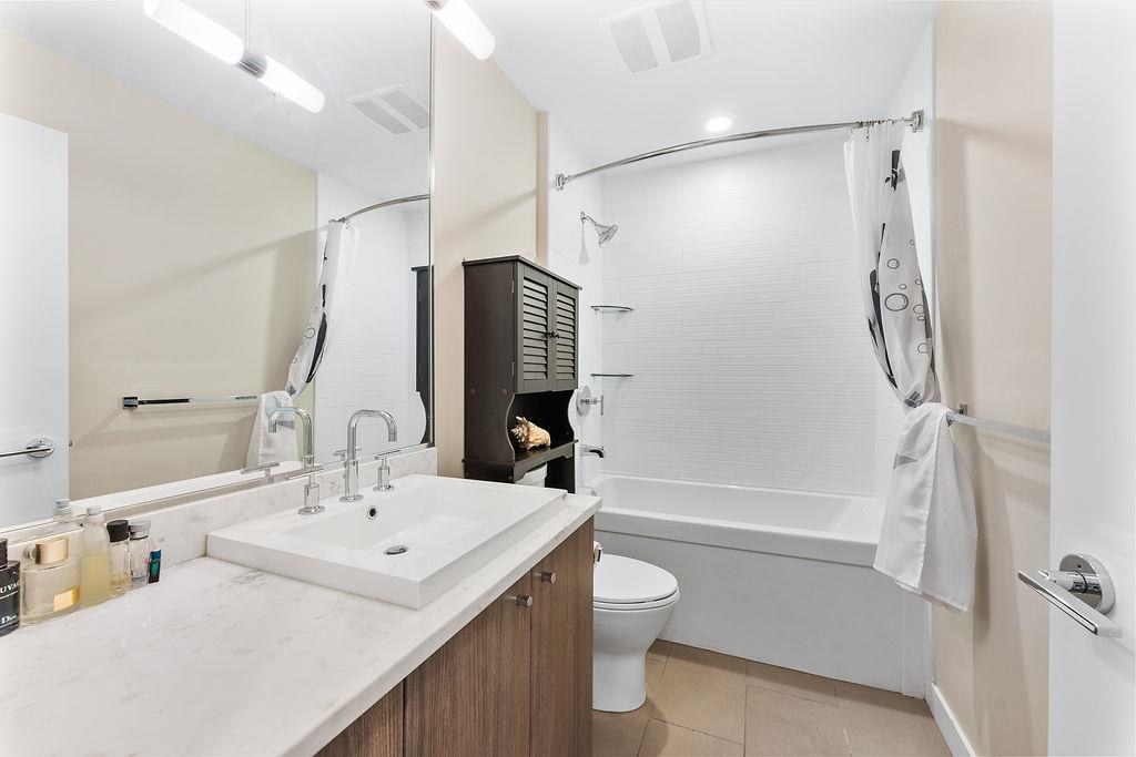 Basement Recreation Room Photo of 104 9350 University High Street, Burnaby, BC