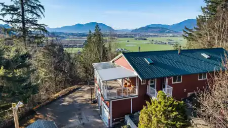 Front exterior of 48585 Wincott Road, Ryder Lake, BC