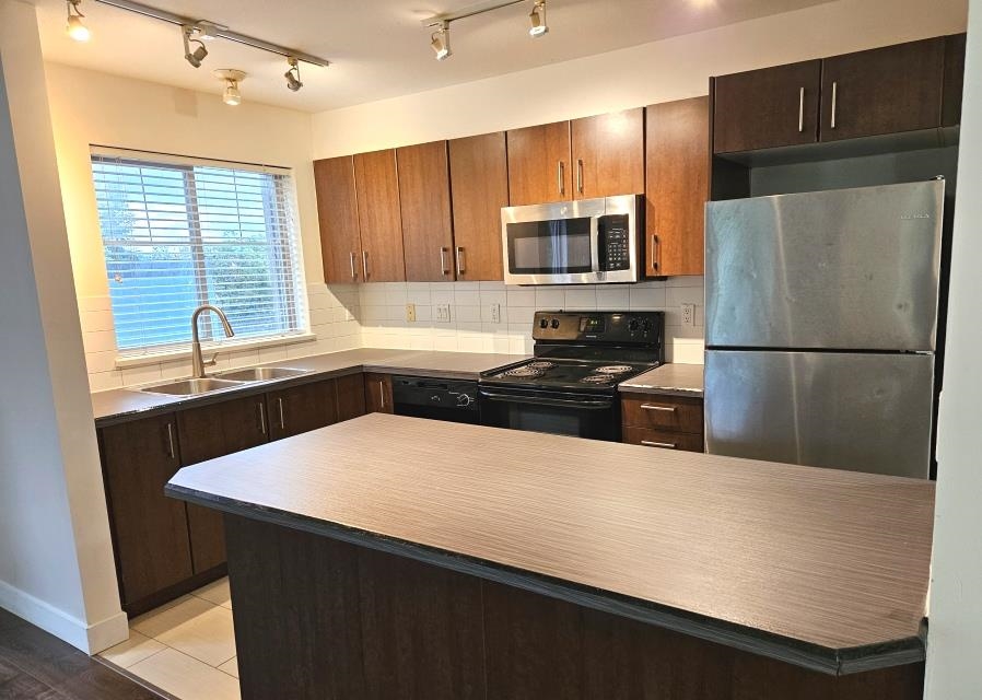 Family Room Photo of 205 45567 Yale Road, Chilliwack, BC