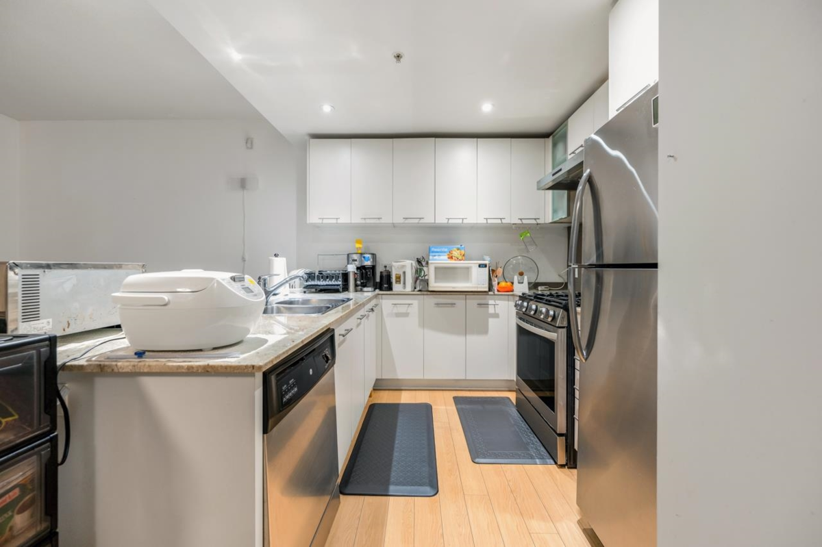 Living Room Photo of 1 3111 Corvette Way, Richmond, BC