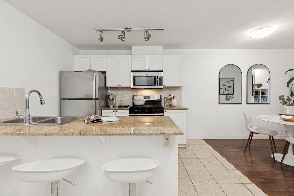 Living Room Photo of 306 2636 E Hastings Street, Vancouver, BC