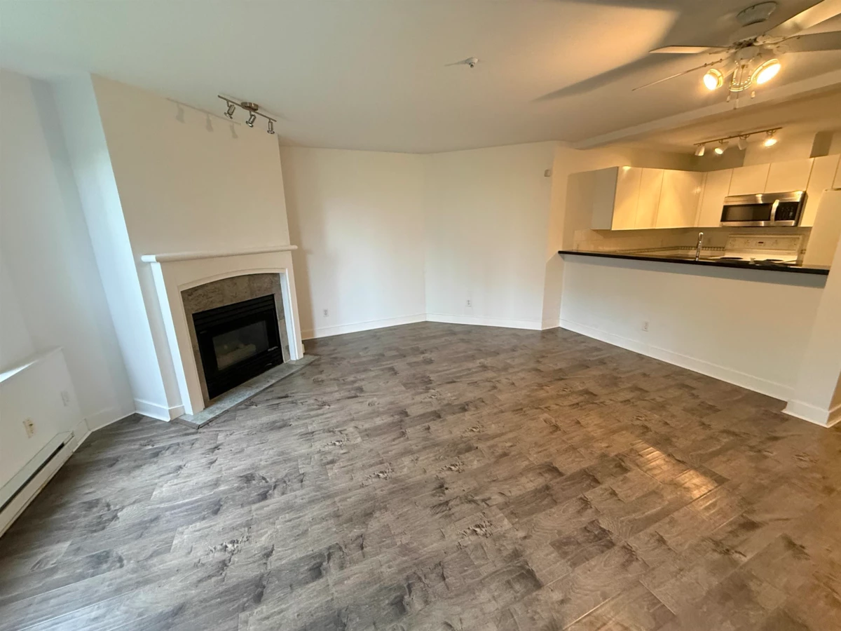 Family Room Photo of 101 8460 Jellicoe Street, Vancouver, BC