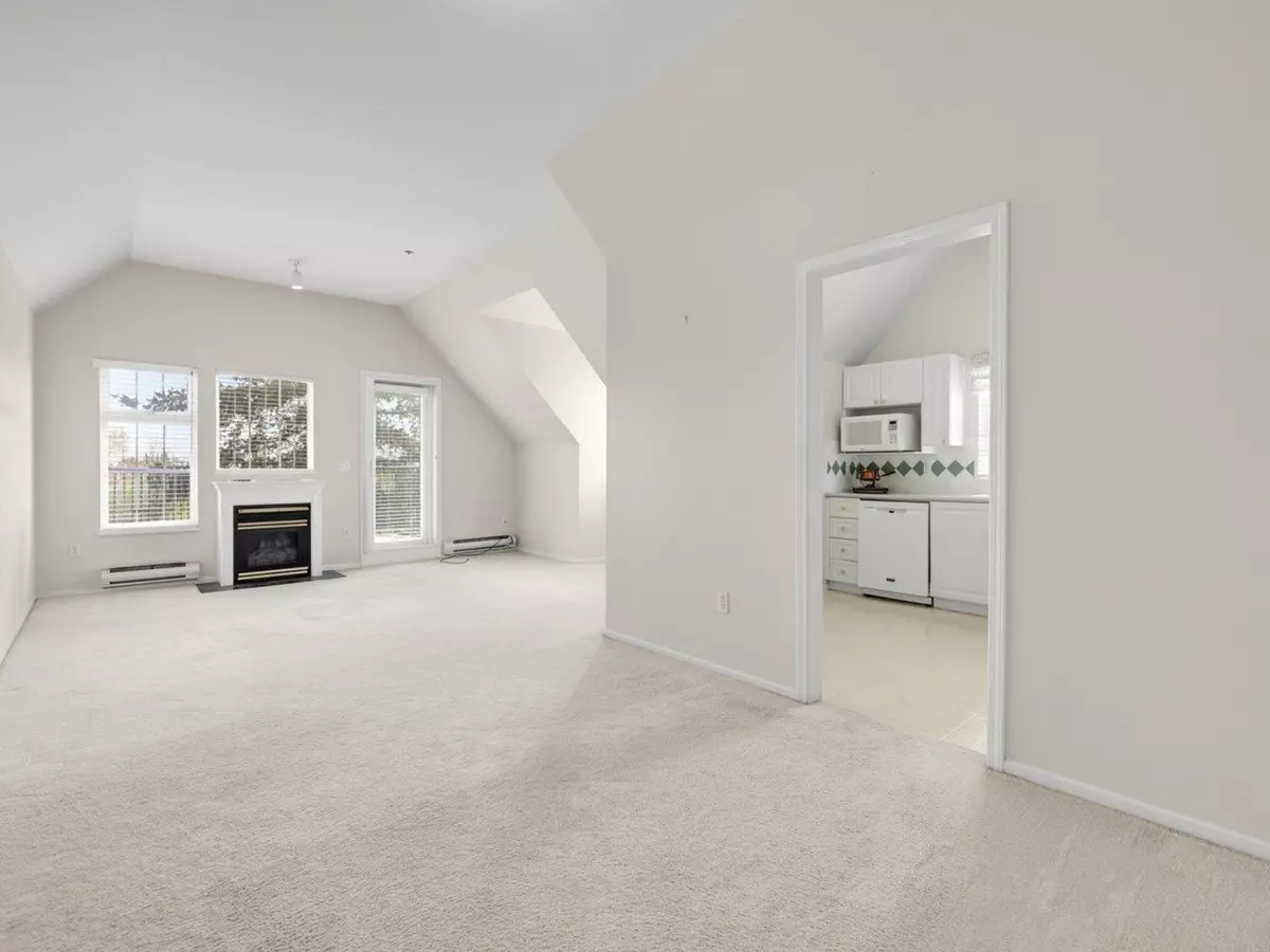 Living Room Photo of 406 5556 14 Avenue, Delta, BC