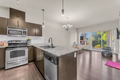 Living Room Photo of 409 9655 King George Boulevard, Surrey, BC