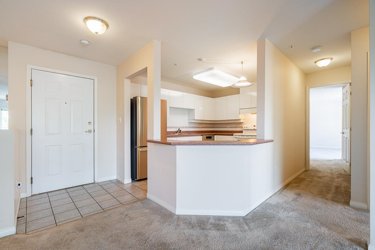 Living Room Photo of 401 15130 29a Avenue, Surrey, BC